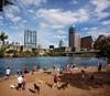 	Downtown Skyline over Lady Bird Lake from Auditorium Shores Dog park - Austin - Texas